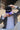 Man in a sport coat wearing the Classic Cowboy Panther black and purple snapback.