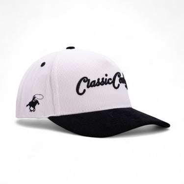 Classic Cowboy The Formal white and black corduroy snapback with raised script embroidery, angled view.