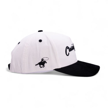 Classic Cowboy The Formal white and black corduroy snapback, side view of the bronc rider logo.