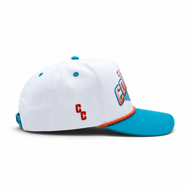 Classic Cowboy The South Beach white and teal roper snapback, side view of the orange CC logo.