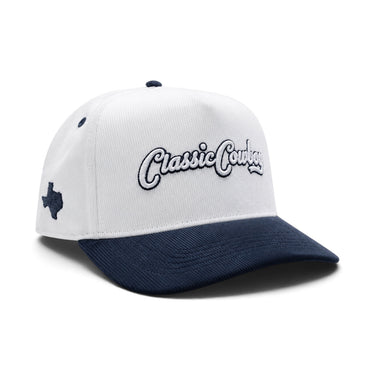 Classic Cowboy The Landry white and navy corduroy snapback with Texas side embroidery, angled view.