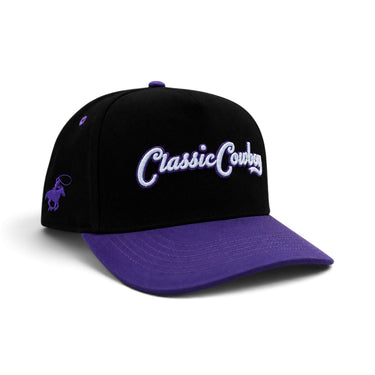 Classic Cowboy The Panther black and purple snapback with white script embroidery, angled view.