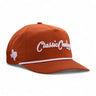 Classic Cowboy The Bevo burnt orange western roper with white accents, front view.