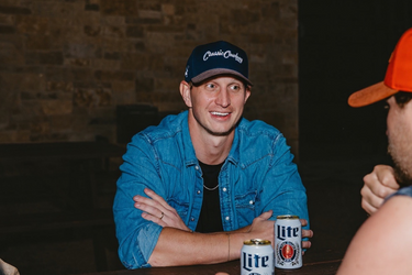 Classic Cowboy The Cal navy suede brim snapback on display.