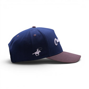 The Cal deep navy snapback with grey suede brim, front view.