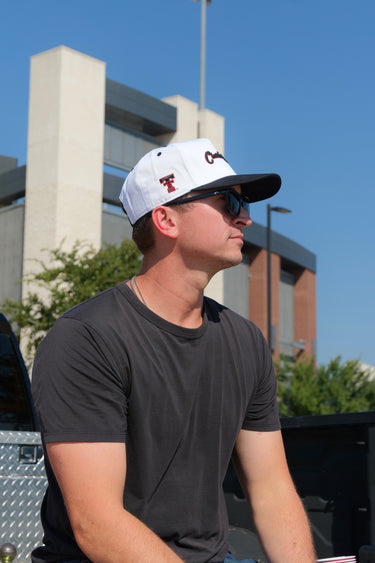 Man wearing the Classic Cowboy Broadway Texas Tech snapback at a tailgate.