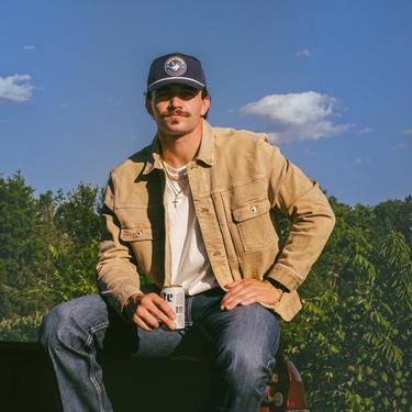 Classic Cowboy The Clubhouse performance golf hat worn, lifestyle photo.