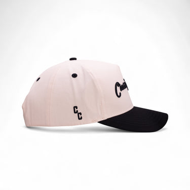The Kelce off-white and black western snapback, side view.