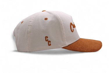 The Dram sandstone corduroy snapback, side view.