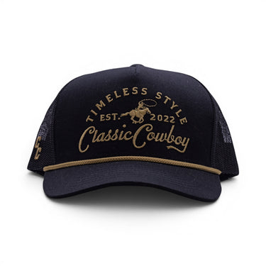 The Outpost black mesh back western trucker hat, front view with Timeless Style graphic.