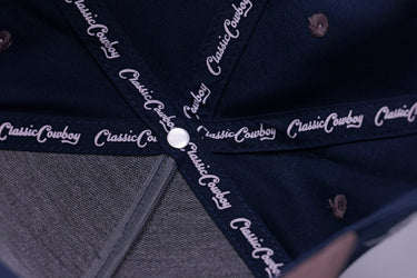 The Cal western snapback with bronc rider side detail, side view.