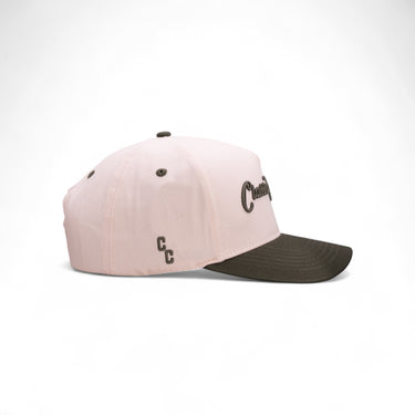 The Pine off-white and green western snapback, side view.