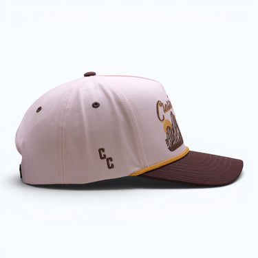 The Sierra cream and brown snapback with golden rope detail, side view.