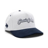 Classic Cowboy The Landry white and navy corduroy snapback with Texas side embroidery, angled view.