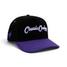 Classic Cowboy The Panther black and purple snapback with white script embroidery, angled view.