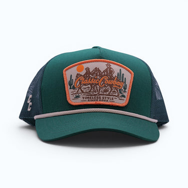 The Trailhead green mesh back western trucker hat, side view showing embroidered CC detail.