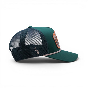 The Trailhead green trucker hat with mesh back, back view.
