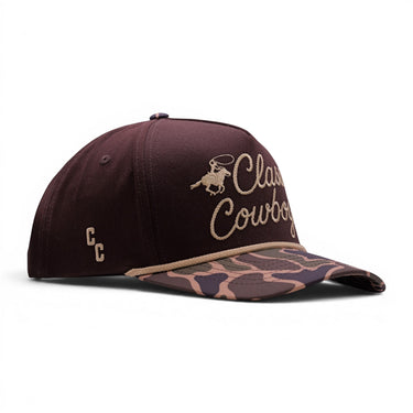 Classic Cowboy The Vaquero baseball cap in deep brown with embroidered logo and camouflage brim.